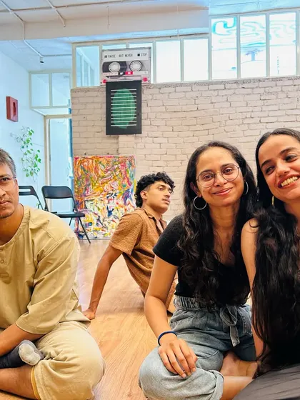 A candid moment of relaxation and connection after a beginner class. We love creating a space where students can feel at home.