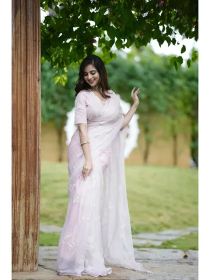 A final look at the blush pink hand-embroidered saree, a masterpiece of craftsmanship.