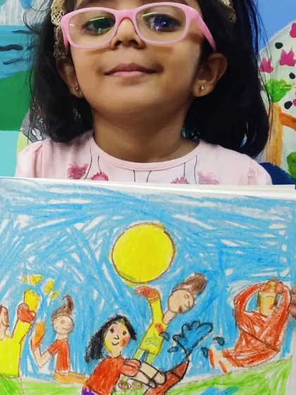 A vibrant drawing capturing the fun of Holi. The artist used bright colours to show people playing with water and colours under a big yellow sun, perfectly conveying a festive and joyful mood.