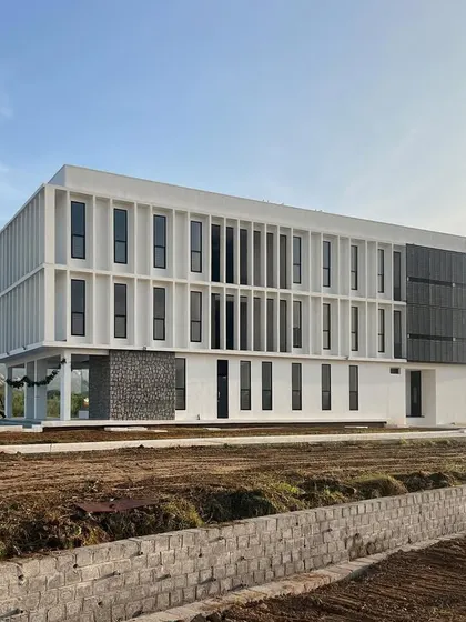 The hostel is designed to be a safe, comfortable, and resilient environment for students. The clean, modern facade sits comfortably in the rural landscape, providing a sense of belonging and promoting physical well being.