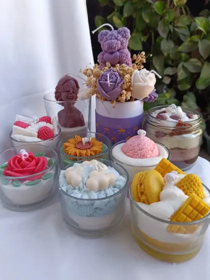 A delightful collection of my dessert-inspired candles. This image showcases the variety I offer, from ice cream and waffle candles to tiramisu jars and flower-topped treats.