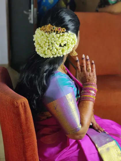 Another angle of the elegant hairstyle, showcasing the intricate details of the hair jewellery.