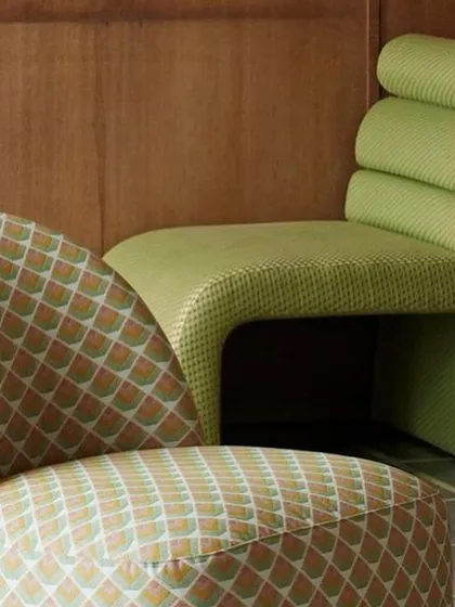A closer look at the 'Vanity' and 'Zig Zag' chairs reveals the texture of their respective fabrics. One features a solid color with a subtle weave, while the other boasts a playful, repeating geometric pattern, offering endless design possibilities.