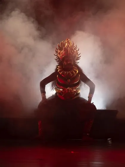 The dramatic entrance of a character from "KRISHNA", shrouded in smoke and powerful red light. We use these theatrical elements to build intensity and highlight pivotal moments in the narrative.