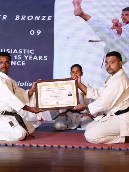 A Sensei receiving his Nidan (2nd degree black belt) certificate. Our path of learning never ends, and we encourage continuous growth among our instructors and students.
