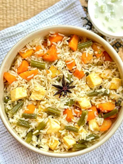 A beautiful tricolor-inspired paneer and vegetable pulav, celebrating fresh flavors with carrots, beans, and soft paneer.
