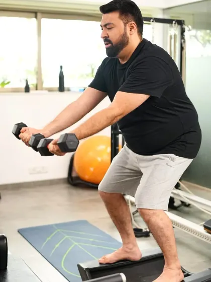 Here's a look at a couple training together at our studio. They are working on their strength and balance with dumbbells on an unstable surface, making their workout both challenging and fun.