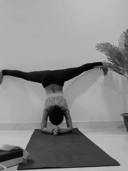 A demonstration of Samakonasana, the side splits, performed in an inversion against the wall. This is an intense hip opener that requires dedicated practice.