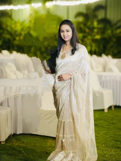 Our client Sowmya looking graceful and refined in a designer embroidered pure tissue silk saree.
