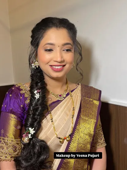 A close-up of this client's beautiful, soft makeup and intricate hairstyle. She came all the way from the UK for a family function.
