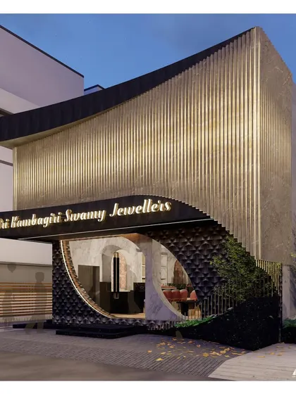 A night-time view showing the glowing entrance and the subtle illumination on the textured base. The design ensures that even the lower portion of the building contributes to the overall sense of luxury and welcome.