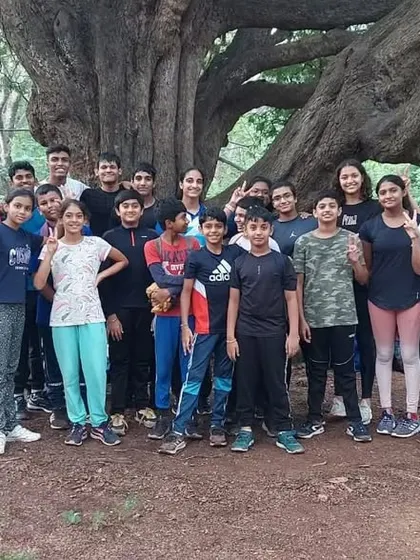 Our team isn't just confined to the pool. Here is a group shot of my swimmers and coaches during a morning jogging session in the park, building cardiovascular endurance.