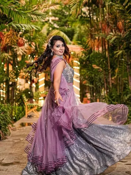 A twirl to remember. This lavender and silver lehenga-style gown is full of movement and sparkle, creating a glamorous and fun look for any celebration.