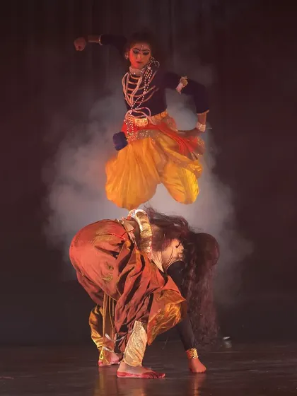 The energy and athleticism of our dancers are central to our productions. This dynamic leap from our "KRISHNA" dance drama captures the playful and powerful spirit of the divine, a moment of pure joy and devotion on stage.