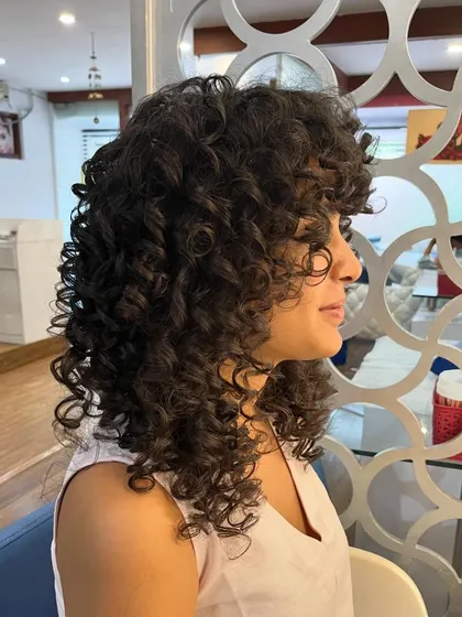 Rajeshwari’s curly shag, refreshed to bring back its shape and bounce.