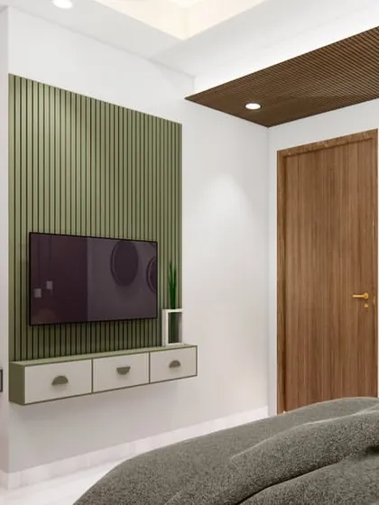 The integrated study unit in this bedroom is both functional and stylish. The green fluted panel adds texture and color, while the open shelves provide space for books and decor.