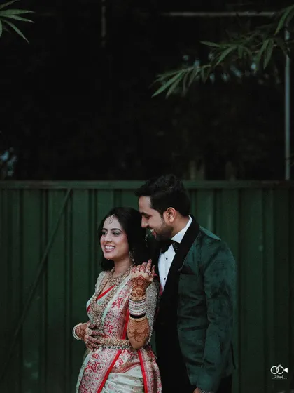 A candid portrait of the couple outdoors at their reception, sharing a moment of connection.