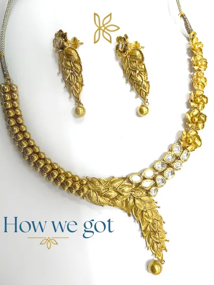 The original pieces we received for a major transformation. This image shows the 'before' state of a gold necklace that was later upcycled into an asymmetrical statement piece.