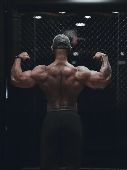 A variation of the back pose, showcasing the dense muscle and definition across the entire back.