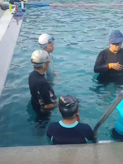 It's okay to ask for help, and our coaches are always there to provide it. Here, a coach gives personalized feedback to a swimmer in our ladies-only batch, ensuring a comfortable and supportive learning environment.