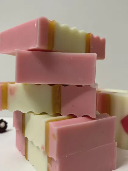 A close-up of the stacked pink heart soaps, highlighting the layers and the embedded heart design.