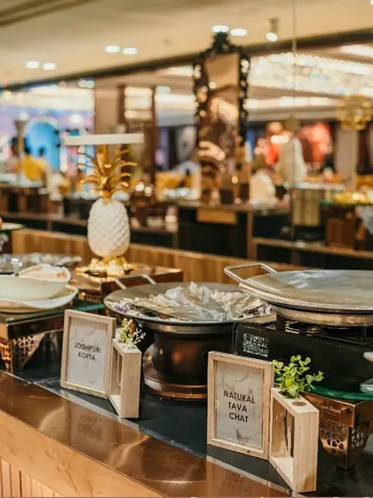A live chaat counter setup, showcasing the fresh ingredients and traditional serveware we use. This station is always a hub of activity and delicious aromas.