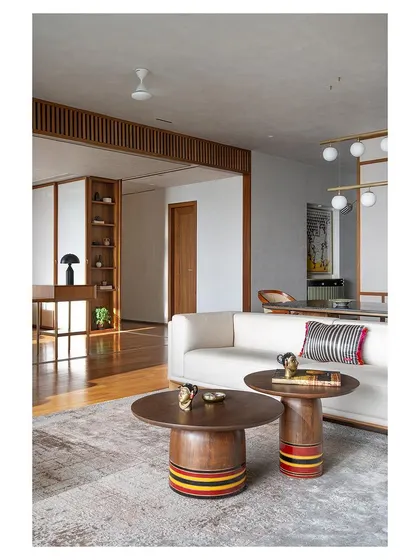 These nesting coffee tables, with their lacquered, colorful bases, are another nod to Channapatna toy craft. They are custom-designed, functional sculptures that add a playful touch to the living room.