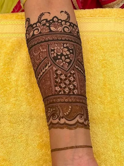 A beautiful armband design with a focus on floral and geometric patterns.