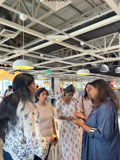 Connecting with attendees after a workshop is one of my favorite parts. Here, I am chatting with a few participants and answering their questions after my session at IKEA.