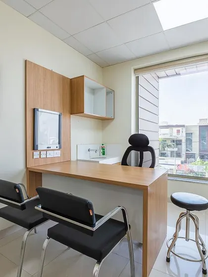 This consultation room at Sarvesh Health City is simple, private, and filled with natural light. The design provides a comfortable and professional setting for doctor-patient interactions.