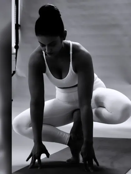 Body achieves what the mind believes. This candid shot captures the moment of focus and preparation before moving into a challenging pose, a reminder that the setup is just as important as the asana itself.