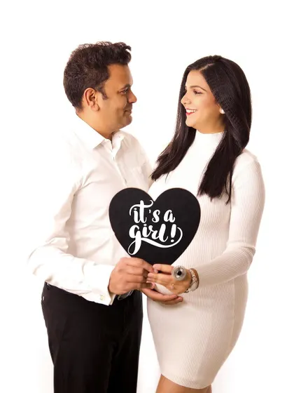 A joyful gender reveal! This is a fun and exciting way to incorporate an announcement into your maternity session, celebrating that "It's a girl!".