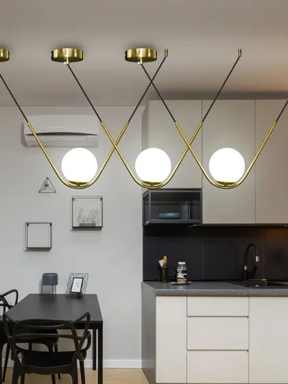 Another look at the wavy globe pendant, showing its elegance in a smaller kitchen space. It provides excellent task lighting with a touch of modern style.
