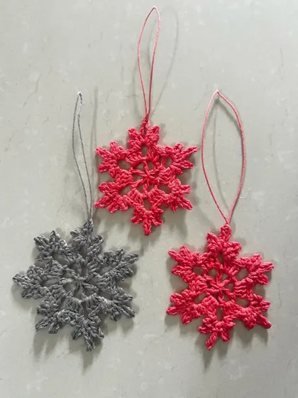A set of my beautiful crocheted snowflake ornaments in festive red and classic grey. These are lightweight, unbreakable, and can be used year after year.