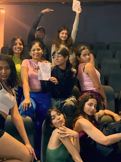 Our performers relaxing in the auditorium seats before the show, saving their energy for the stage.