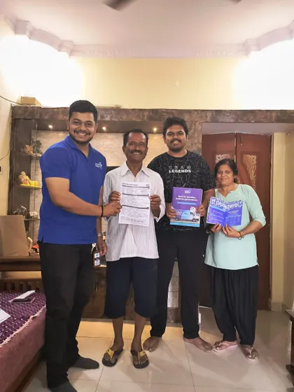 A family receives their solar booklets from our team. We believe in empowering our customers with knowledge.