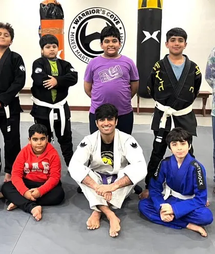Another shot of our BJJ kids team. You can see students of different ages and belt levels training together, creating a family atmosphere where older kids help mentor the younger ones.