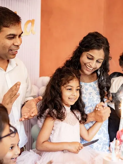 The moment the birthday girl cuts her cake, surrounded by her loving family. Capturing these key moments at birthday parties, with the sparkler lit and everyone smiling, is what makes event photography so special.