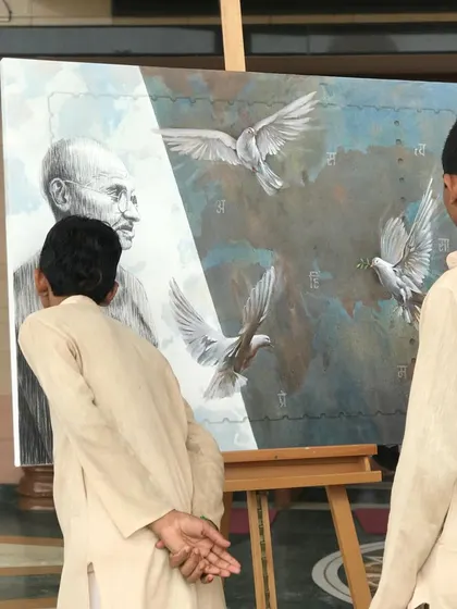 Young students at the camp looking at the finished painting. I hope my art can inspire the next generation to learn about our great leaders.
