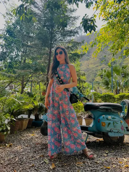 Another shot of the jumpsuit against a vintage scooter. It’s all about finding those picture-perfect moments.
