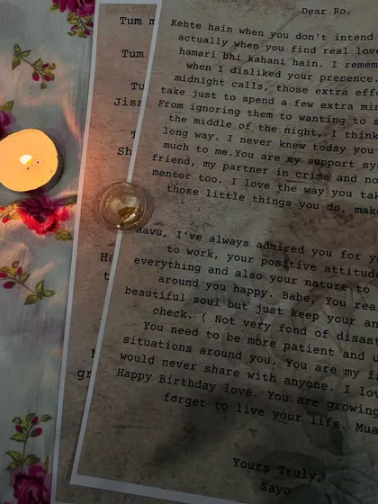 Another perspective of the candlelit letters, showing the custom text and typewriter-style font that adds to the vintage charm.