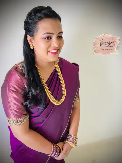 A simple and elegant makeover in a beautiful purple saree. The makeup is kept soft and natural to match her personal style.