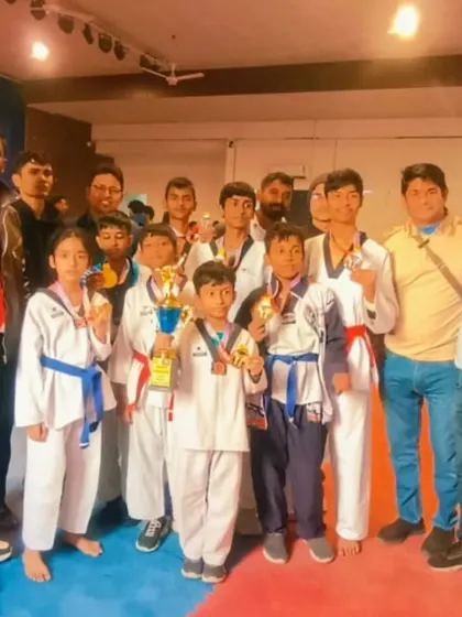 A group photo of my winning team after the Ghaziabad District Taekwondo Championship. So many medals and trophies for our academy.