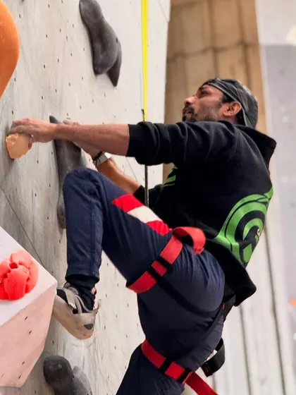 A climber mid-route during our Speed Climbing competition. The auto-belay system allows climbers to focus purely on speed without needing a belay partner.