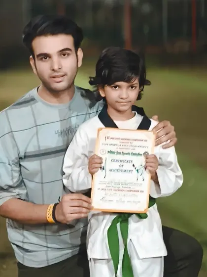 Posing with a student and his new certificate. These moments are what make coaching so rewarding.