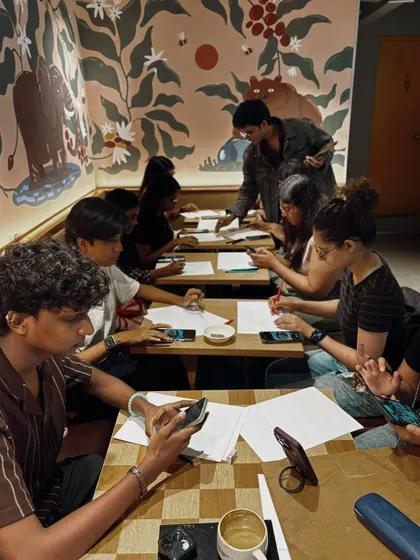 A shot of a busy workshop at a Starbucks Reserve. The beautiful murals in the cafe add to the creative atmosphere.