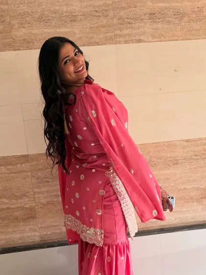 A full view of the client with her lovely wavy hair. She looks so happy and confident!