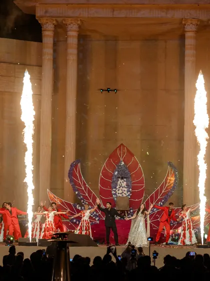 A high-energy performance on the 50-foot tall grand stage, complete with dancers, pyrotechnics, and a dramatic floral-inspired backdrop. This stage was the epicenter of the evening's entertainment.