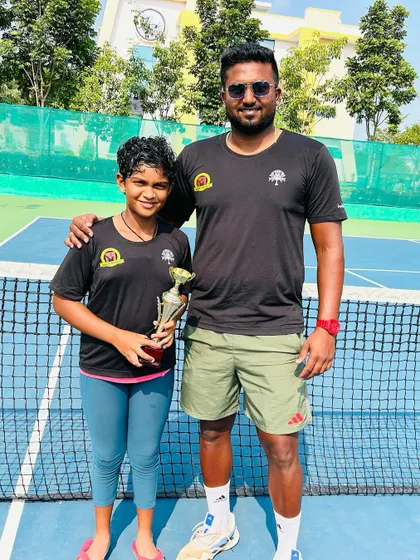 Our player with her coach, proudly displaying her NS U/12 winner's trophy.
