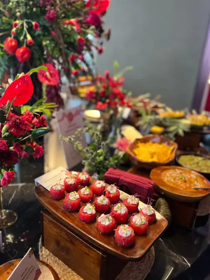 A close-up of one of our appetizers from a Mexican-themed event. These are stuffed cherry tomatoes, offering a fresh and juicy bite that's full of flavor.